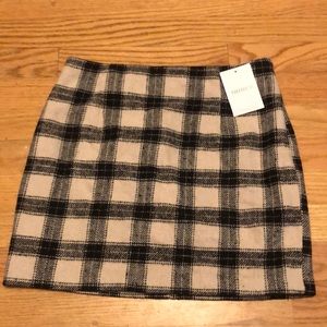 Brand new beige short skirt. Wonderful for lots of different occasions.